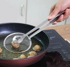 Frying strainer tongs lifting fried food and draining excess oil