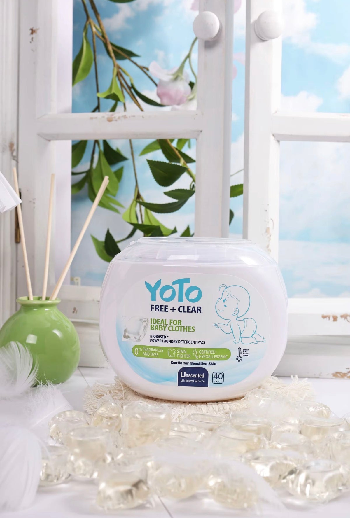 YOTO Free + Clear baby clothes laundry pods container with detergent capsules