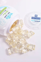 YOTO Free + Clear unscented laundry detergent capsules spilling from container