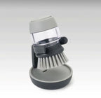 Soap dispensing sink cleaning brush with holder and drip tray